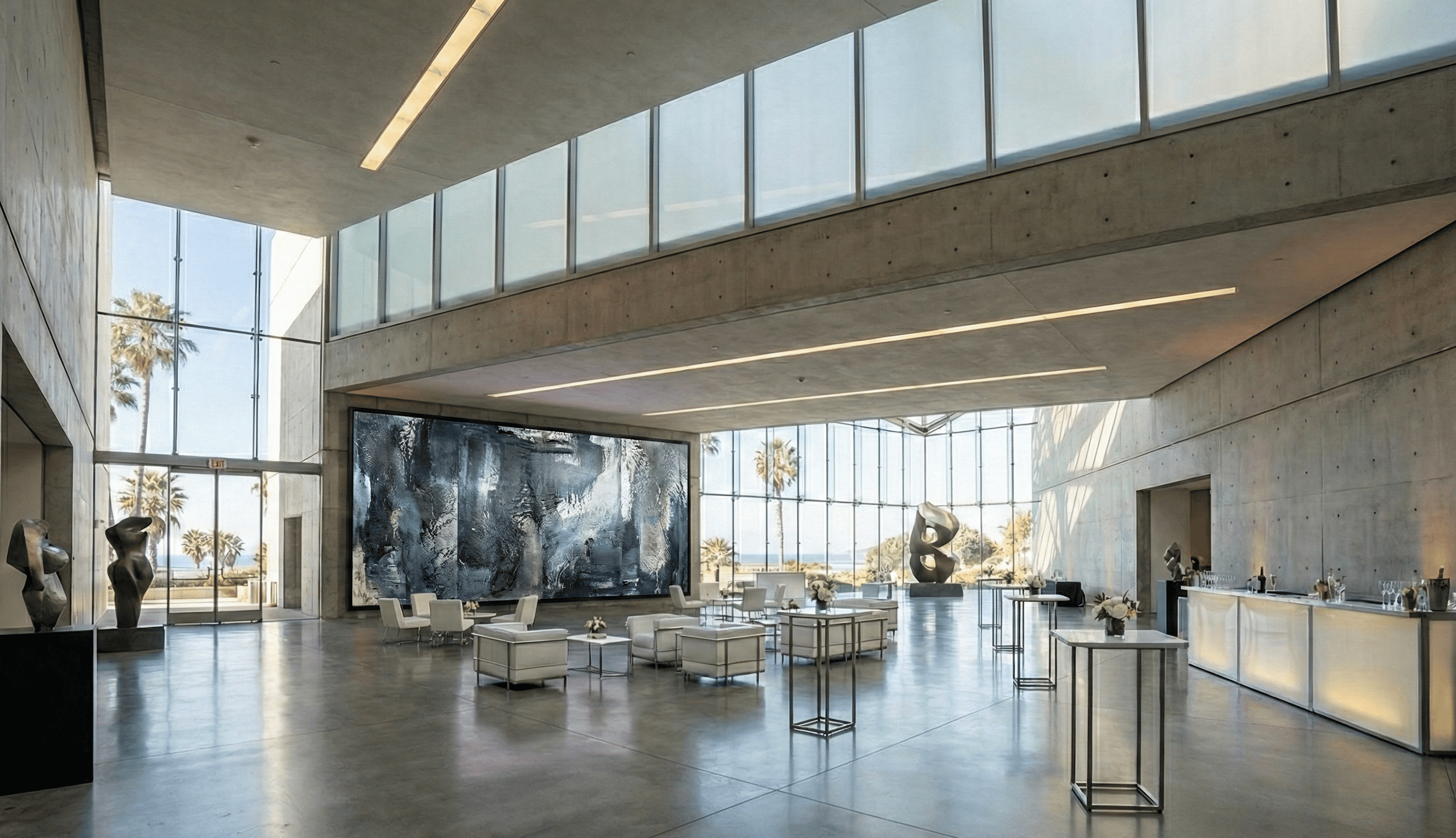 Modern atrium lobby with natural light flooding through glass ceiling